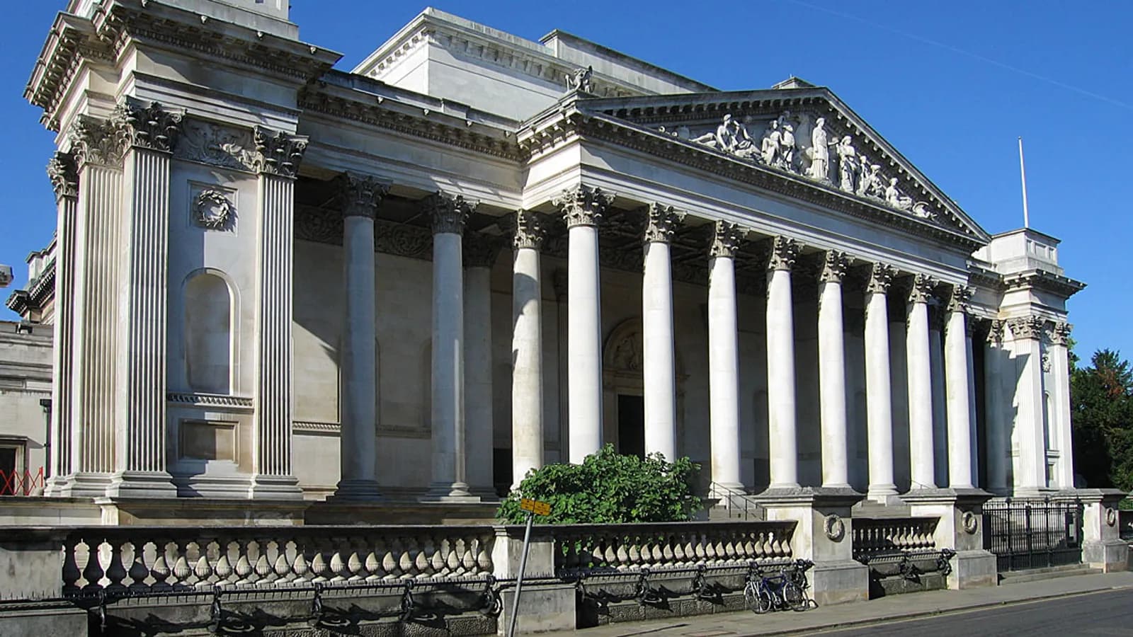 The neoclassical columns and portico of the Fitzwilliam Museum on Trumpington Street, Cambridge